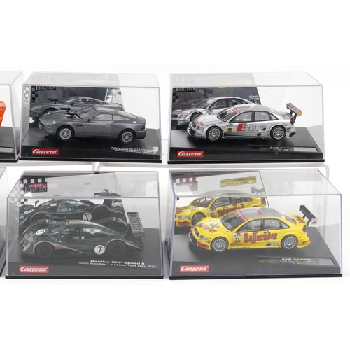 1676 - Six Carrera Evolution slot cars with cases comprising Porsche 935, Aston Martin V12 Vanquis, Audi A4... 