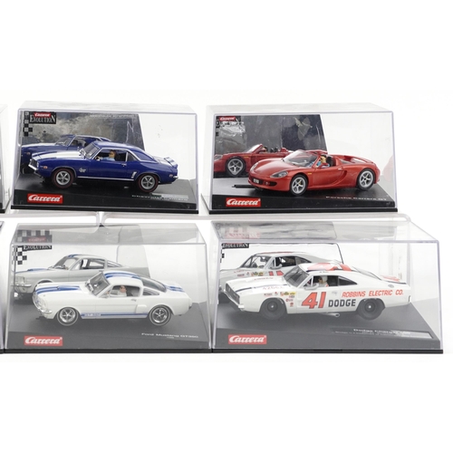 1637 - Six Carrera Evolution slot cars with cases comprising Dodge Charger 500, Porsche Carrera GT, Chevrol... 