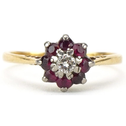 2470 - 18ct gold diamond and ruby flower head ring, the diamond approximately 0.10 carat, size N, 2.6g