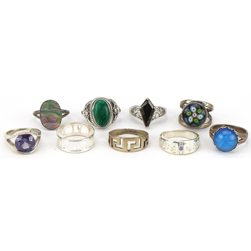 2684 - Nine silver rings, some set with semi precious stones and millefiori glass, various sizes, total 41.... 