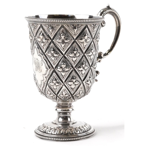 152 - Martin, Hall & Co, Victorian aesthetic silver pedestal cup embossed with stylised flowers, Sheffield... 