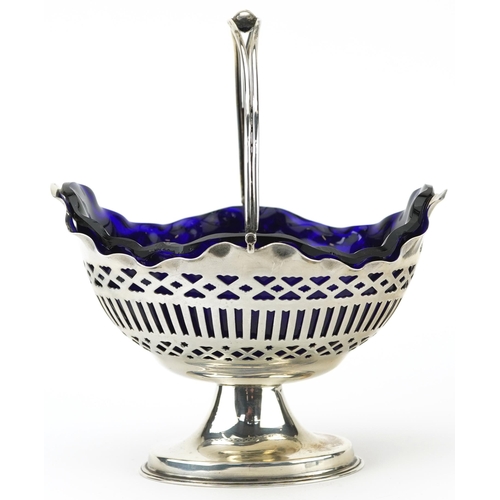 155 - William Aitken, Edwardian silver pedestal bonbon dish with swing handle and blue glass liner, Birmin... 