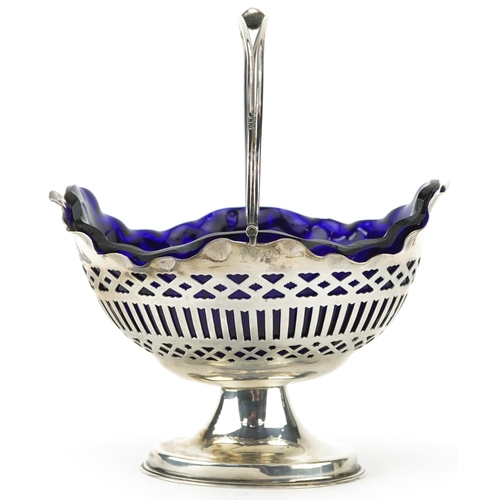 155 - William Aitken, Edwardian silver pedestal bonbon dish with swing handle and blue glass liner, Birmin... 