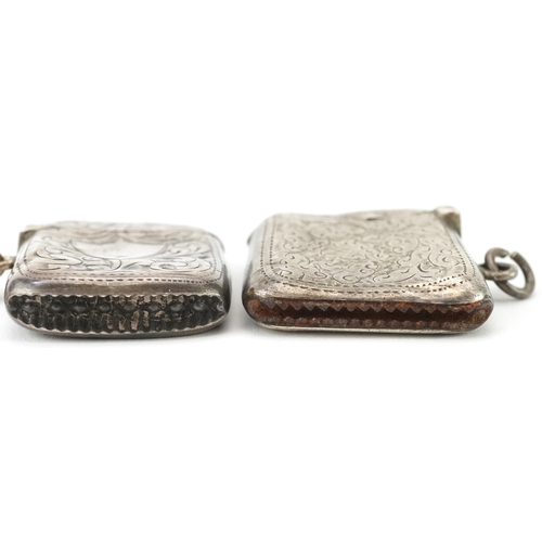 334 - Two Edwardian and later silver floral engraved vestas, one on a silver chain, each 4cm high, total 5... 