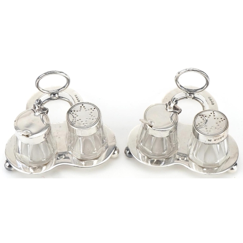 500 - Hukin & Heath, two Victorian silver cruet sets on stand with glass jars, London 1885, each 8cm high,... 