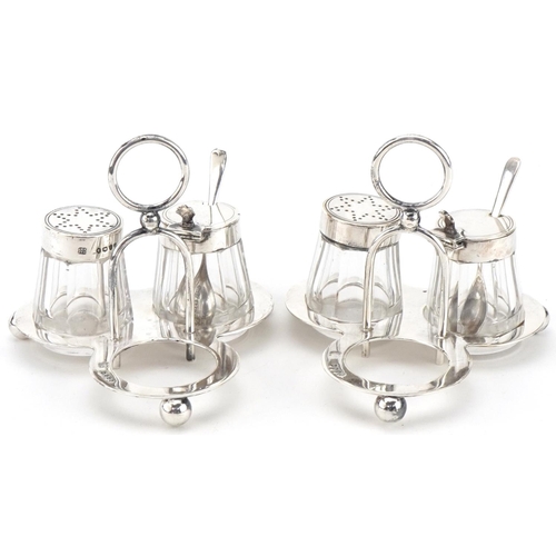 500 - Hukin & Heath, two Victorian silver cruet sets on stand with glass jars, London 1885, each 8cm high,... 