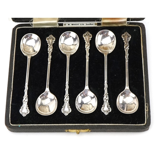 509 - A J Bailey, set of six George VI silver coffee bean spoons housed in a velvet and silk lined fitted ... 