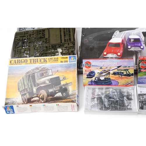 1685 - Vintage and later model kits, slot car racing tracks and toy collector's guides including SCX 1:32 s... 