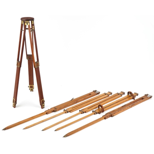 744A - Edwardian mahogany and brass folding camera tripods