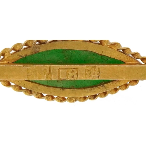 2049 - Chinese 18ct gold green jade bar brooch on a yellow metal safety chain, 3.5cm wide, total 3.4g