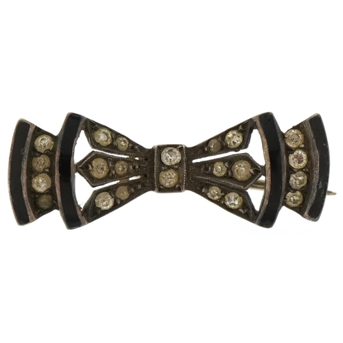 2061 - Art Deco unmarked silver, black enamel and clear stone brooch in the form of a bow, 3cm wide, 4.2g