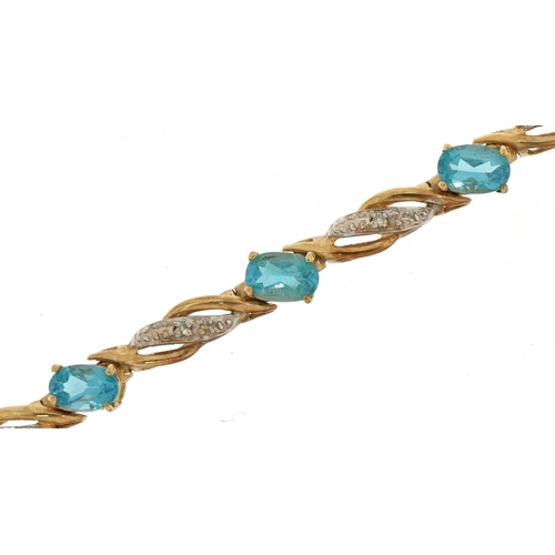 2062 - 9ct gold blue topaz and diamond line bracelet, 19cm in length, 7.4g