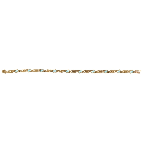 2062 - 9ct gold blue topaz and diamond line bracelet, 19cm in length, 7.4g