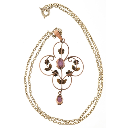 2035 - Edwardian 9ct gold purple stone openwork pendant on a yellow metal necklace, 4.5cm high and 36cm in ... 