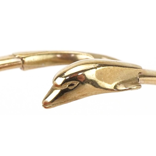 2012 - 9ct gold bangle in the form of a dolphin, 6.5cm in diameter, 6.4g