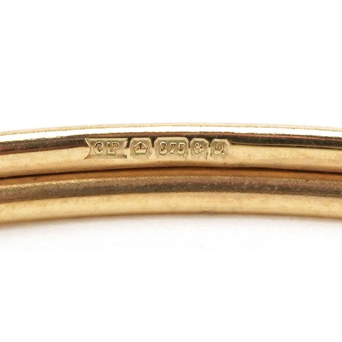 2012 - 9ct gold bangle in the form of a dolphin, 6.5cm in diameter, 6.4g