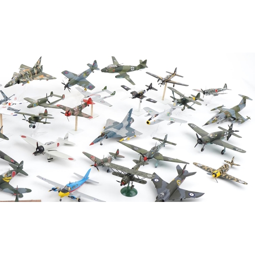 1606 - Collection of scratch built model military aircraft, the largest 30cm wide