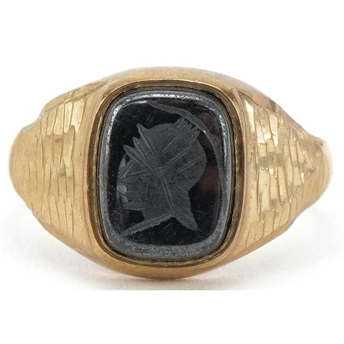 2228 - 9ct gold intaglio seal ring carved with a gladiator head, size M, 2.7g