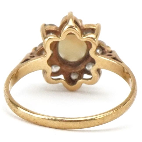 2322 - 9ct gold cabochon opal and clear stone flower head ring, size M, 2.2g