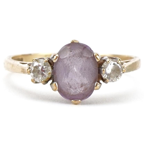 2152 - 9ct gold amethyst and clear stone three stone ring, size P, 2.2g