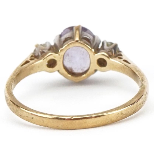 2152 - 9ct gold amethyst and clear stone three stone ring, size P, 2.2g