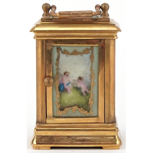 62 - Miniature brass cased carriage clock with Sevres type porcelain panels decorated with Putti, 8cm hig... 