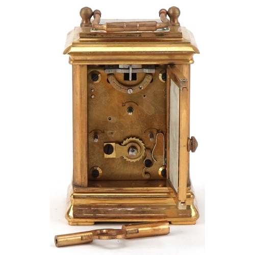 62 - Miniature brass cased carriage clock with Sevres type porcelain panels decorated with Putti, 8cm hig... 