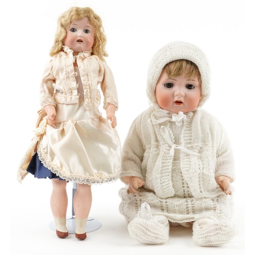 1516 - Bisque headed baby doll stamped BP together with a jointed bisque headed doll the largest 36cm high