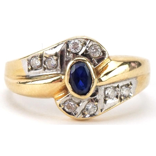 2089 - Modernist 14ct gold sapphire and clear stone crossover ring, size O, 3.8g