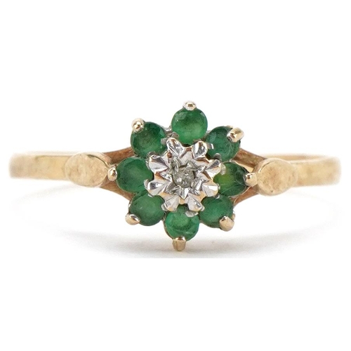 2235 - 9ct gold diamond and emerald flower head ring, size P, 1.3g