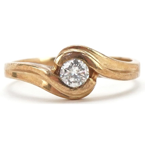 2120 - 9ct gold diamond solitaire crossover ring, the diamond approximately 0.20 carat, size N, 2.7g