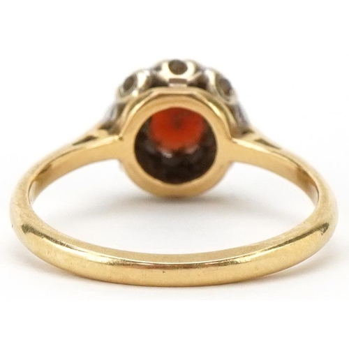 2272 - 18ct gold garnet and diamond cluster ring, size M, 2.8g