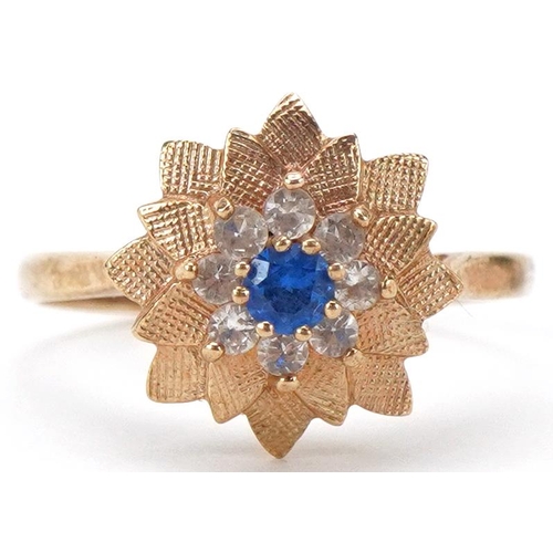 2280 - 9ct gold blue and white spinel flower head ring, size Q/R, 3.0g