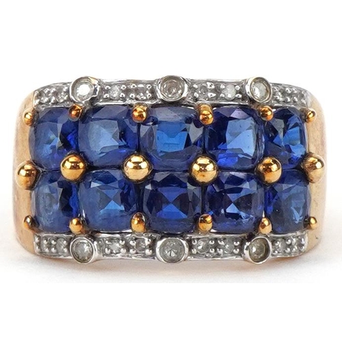 2060 - 9ct gold blue spinel and diamond four row cluster ring, size P, 4.4g