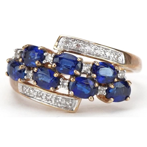 2039 - 9ct gold blue spinel and diamond crossover cluster ring, size P, 2.8g