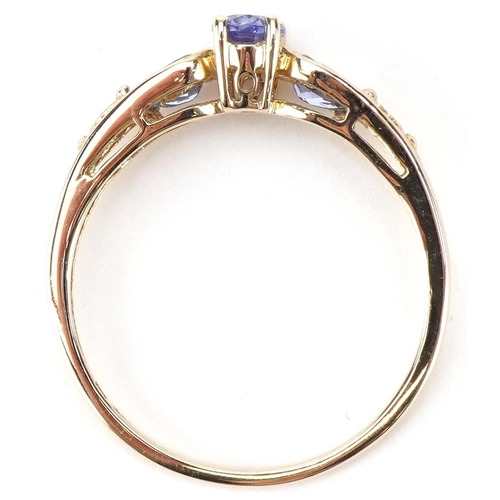 2445 - 9ct gold iolite three stone ring, size T, 2.0g