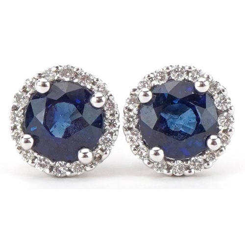 2052 - Pair of unmarked gold diamond and sapphire stud earrings, each sapphire approximately 5.50mm in diam... 