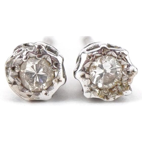 2245 - Pair of unmarked diamond solitaire stud earrings, each 4.0mm in diameter, total 1.0g