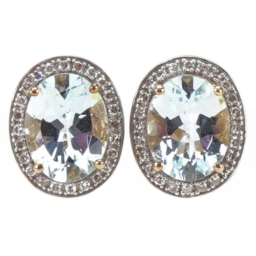 2104 - Pair of 9ct gold aquamarine and diamond cluster stud earrings, each 1.2cm high, total 2.6g