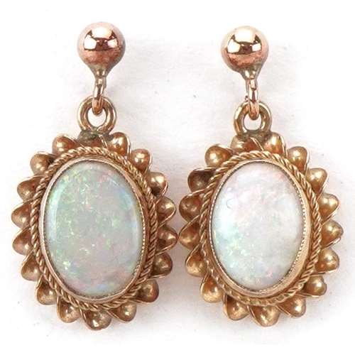 2111 - Pair of 9ct gold cabochon opal drop earrings, each 1.6cm high, total 1.4g