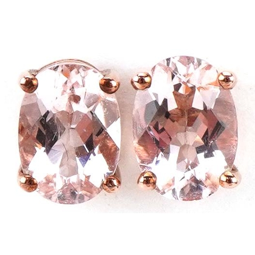 2232 - Pair of 9ct rose gold pink stone stud earrings, each 7mm high, total 1.1g