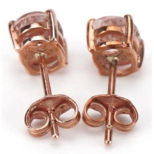 2232 - Pair of 9ct rose gold pink stone stud earrings, each 7mm high, total 1.1g