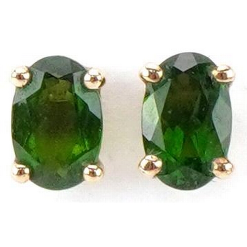 2348 - Pair of 9ct gold green stone solitaire stud earrings, possibly olivine, each 6.0mm high, total 0.8g