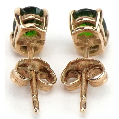 2348 - Pair of 9ct gold green stone solitaire stud earrings, possibly olivine, each 6.0mm high, total 0.8g