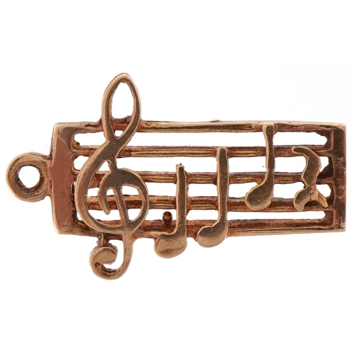 2487 - 9ct gold charm in the form of musical notes, 2.2cm high, 1.4g