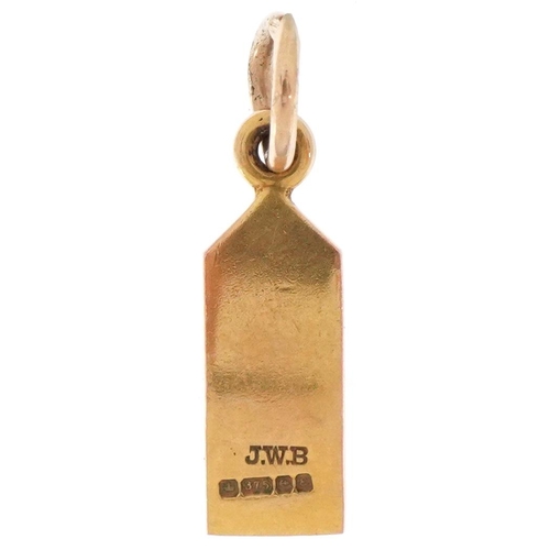 2449 - 9ct gold and enamel charm in the form of a luggage tag, 1.7cm high, 1.1g