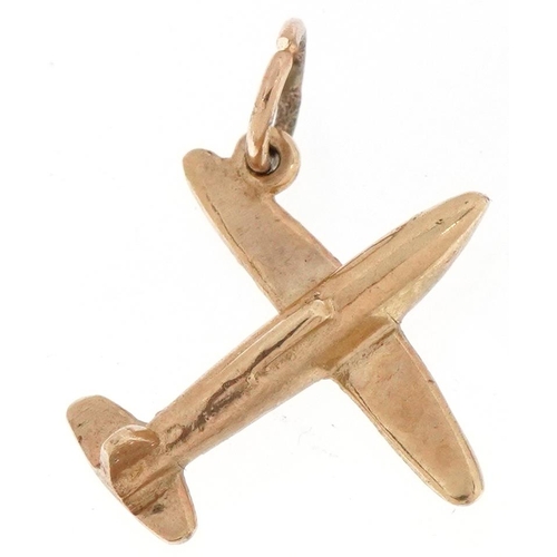 2221 - 9ct gold charm in the form of an aeroplane, 1.8cm in length, 1.6g