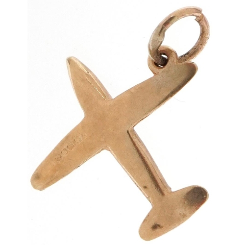 2221 - 9ct gold charm in the form of an aeroplane, 1.8cm in length, 1.6g