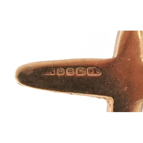 2221 - 9ct gold charm in the form of an aeroplane, 1.8cm in length, 1.6g