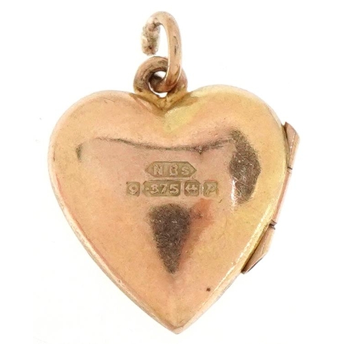 2375 - 9ct gold floral engraved love heart locket, 1.5cm high, 1.5g